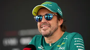 KUALA LUMPUR, MALAYSIA - OCTOBER 01: Fernando Alonso of Spain and Aston Martin F1 Team talks to the